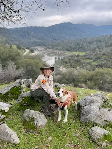 antique photo of people pushing a car up a steep hill
